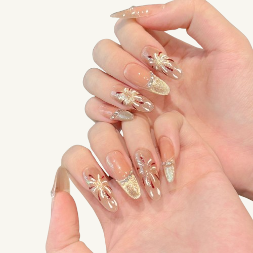 A set of gentle style medium oval press-on nails with a champagne  cat-eye French tip, featuring firework painting and rhinestones on a nude base.