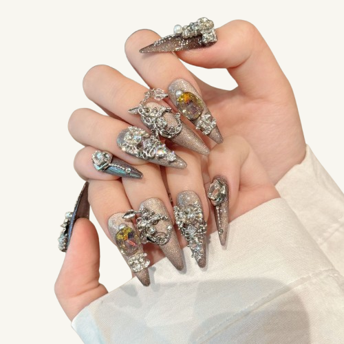 A chandelier-style handmade stiletto press-on set, glitter cat-eye base, with abundant swaying crystal and silver dangles.