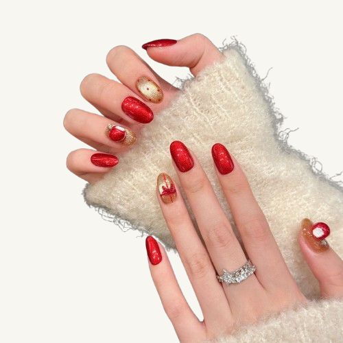 A handmade Christmas-themed short oval press-on set, featuring a 3D red apple, a red bow, and red and gold glitter.