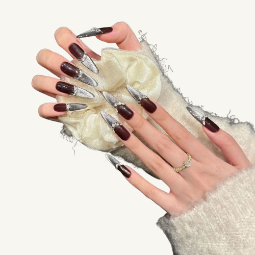 A French-style handmade stiletto press-on set, mocha brown base with a silver cat-eye French tip, and a crystal-accented smile line.