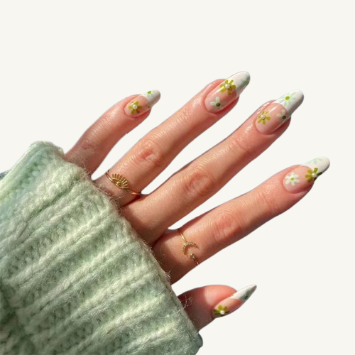 A retro-inspired almond press-on nail set, showcasing a cottagecore vibe with its sage green and white daisy floral pattern.