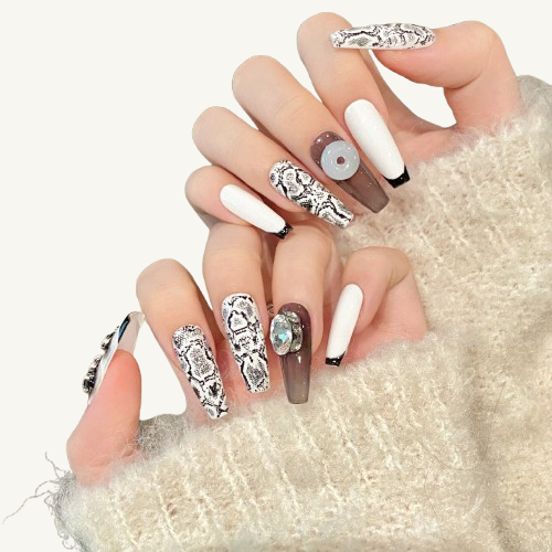 Explore an oriental legend. Handmade press-on nails combine a gentle jade peace buckle, a silver dragon, and snakeskin for a modern, classic look.