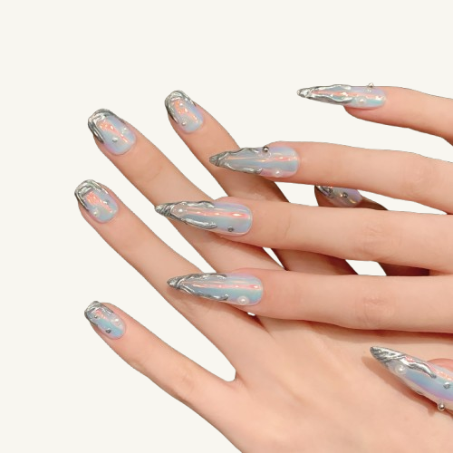 Hands wearing long stiletto press-on nails with an aurora borealis finish and 3D liquid metal decorations.