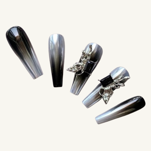 Five black & silver ombre coffin press-on nails, two with 3D liquid metal and black gemstone charms.
