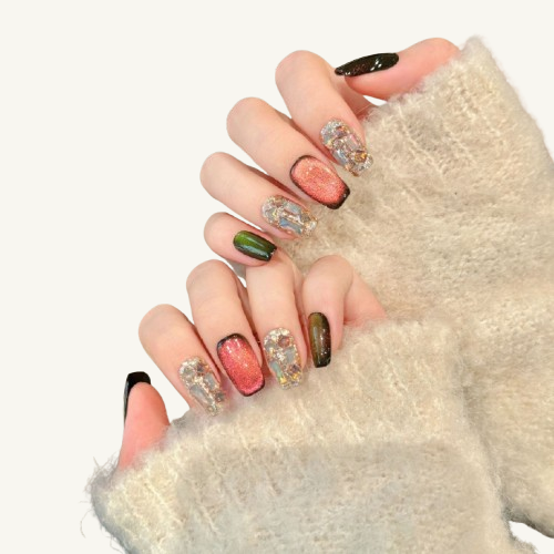 A magic potion themed handmade press-on set, magenta cat-eye, paired with nails fully covered in crystal shards.