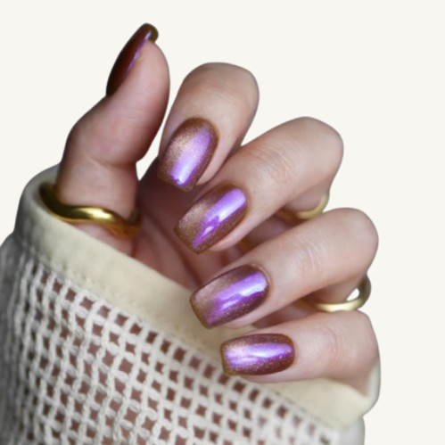 A magic elixir themed set of square press-on nails, bronze base with a purple chameleon cat-eye effect.