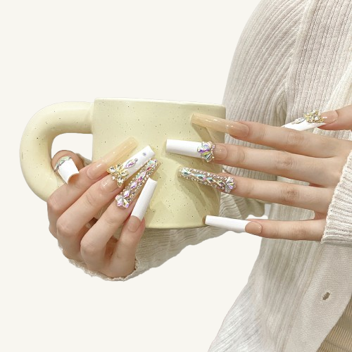 A luxury upgraded French manicure press-on set in milky white and  nude, with a large gold butterfly and full rhinestone charms.