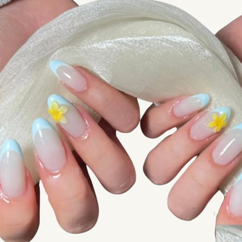 A set of medium almond press-on nails featuring sky blue French tips and 3D yellow floral charms